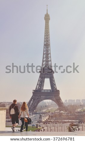 loving couple in Paris with the Eiffel Tower in the Background