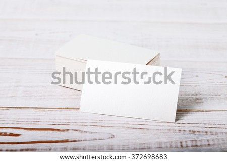 Thick white cotton paper business card mock up on vintage wooden deck