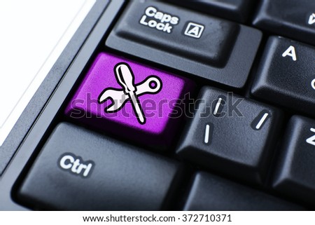 Close-up of laptop keyboard with color button and instruments image on it