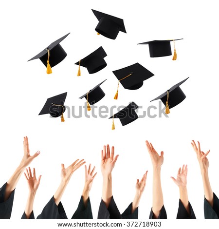 Graduates hands throwing graduation hats , isolated on white Royalty-Free Stock Photo #372718903