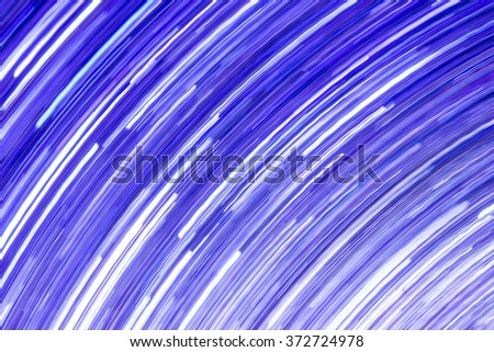 Abstract rotating neon lights texture.
