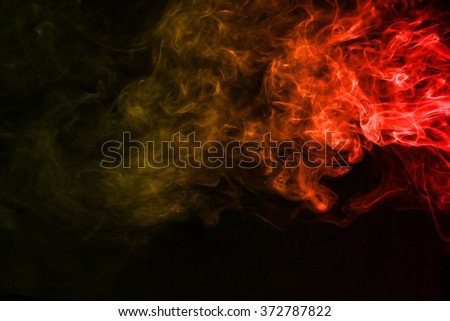 Red yellow smoke texture on dark background