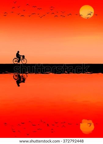 Silhouette and water reflection of cyclists in sunset background