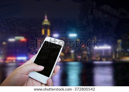 Closed up hand of man touch screen, Night view background