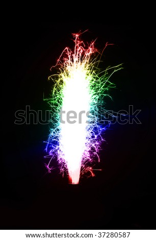 Bright colored birthday fireworks candle over black