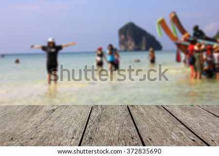 Look out from the table, blur image of beach at Krabi Thailand as background.