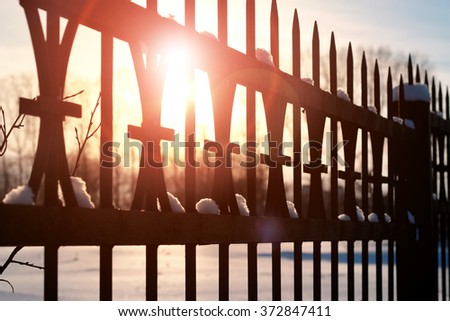 fence with spikes sun