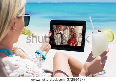 Woman watching movie on tablet computer