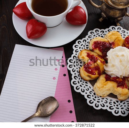 Valentine's day note with a Cup of coffee and dessert. A date in a vintage cafÃ©. Wooden heart on a plate.