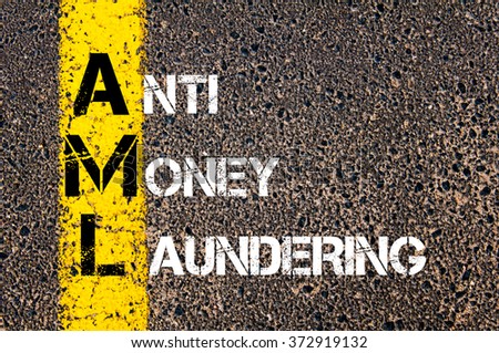 Concept image of Business Acronym AML Anti Money Laundering written over road marking yellow paint line Royalty-Free Stock Photo #372919132