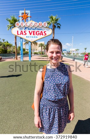 Girl in front of the Welcome to Fabulous Vegas sign