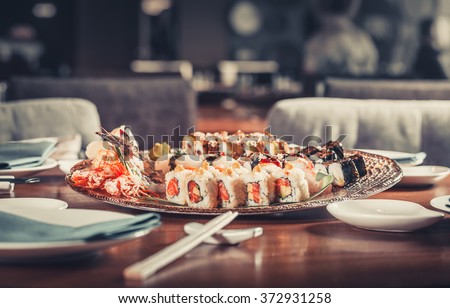 Tasty fresh Japanese sushi with tuna, caviar and shrimps