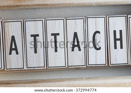 ATTACH word on wood blocks concept