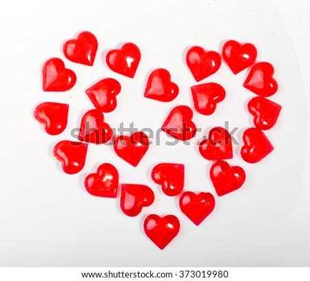 plastic hearts on white background