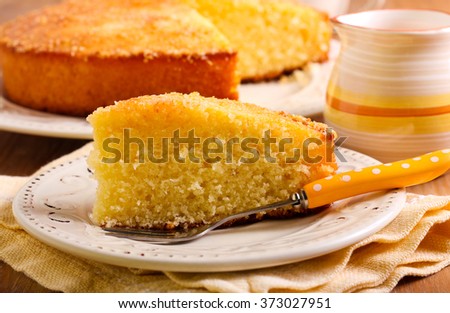 Coconut citrus syrup cake served on plate Royalty-Free Stock Photo #373027951