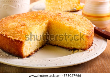 Coconut citrus syrup cake served on plate Royalty-Free Stock Photo #373027966
