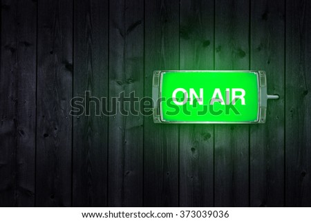 On Air sign, green illuminated radio station signage. Royalty-Free Stock Photo #373039036