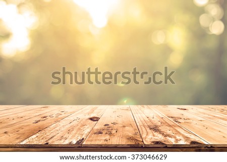 Top of wood table with blurred bokeh nature background - Empty ready for your product display or montage.