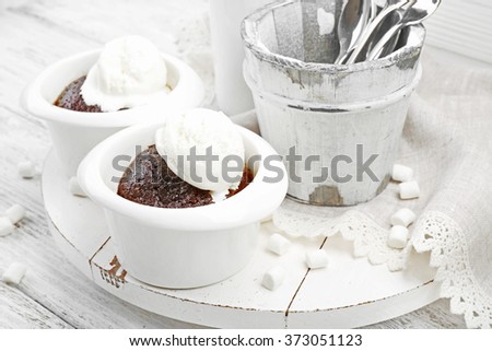 Served table of chocolate lava cake with ice-cream