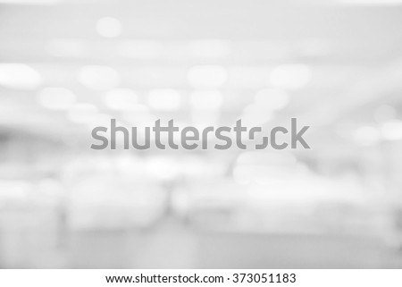 Abstract white and gray bokeh lights background with blurring lights for your design