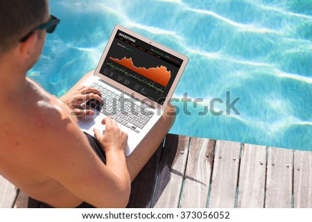 Investor looking at stock quotes on laptop by the pool