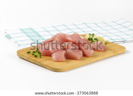 diced turkey breasts on wooden cutting board