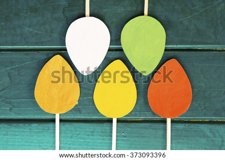 Easter egg and poster on wooden Background