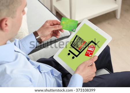 Man shopping online with digital tablet