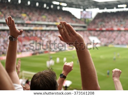 fans in a stadium Royalty-Free Stock Photo #373161208
