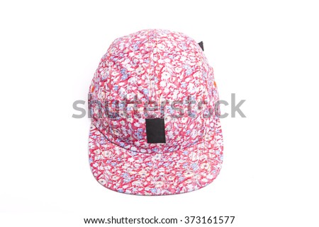 A pink fabric hat(cap) with pattern front side  on the bottom isolated white.