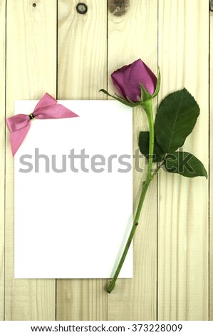 Valentine pink rose, Valentine greeting card on wood background. Royalty-Free Stock Photo #373228009