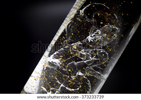 dragon and golden leafs in the bottle, drink water alcohol 