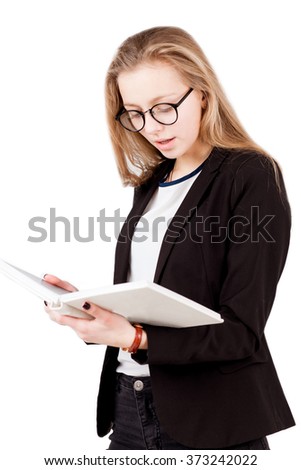Girl in glasses read book isolated on white