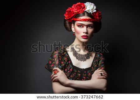 Beautiful girl with red lips and flowers