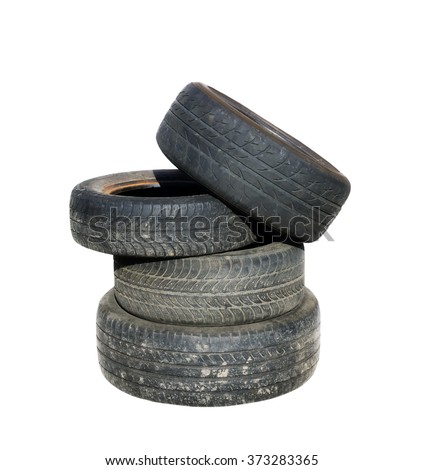 Old tires stacked, isolated on white background Royalty-Free Stock Photo #373283365