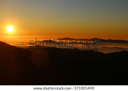 Sunrise sky and sun over the clouds
