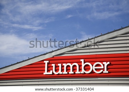 Signage on top of a building for lumber.