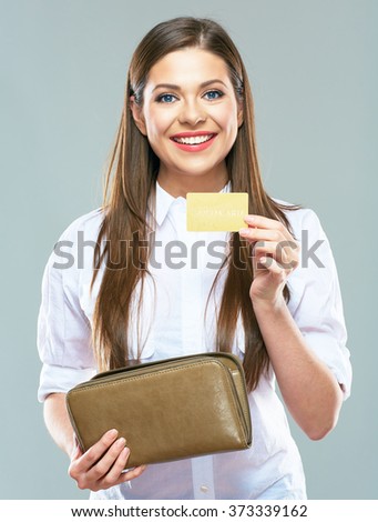 Smiling beautiful business woman pulls from wallet bank credit card. Isolated portrait of  female model with long hair.