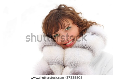 Beautiful woman in the fur coat