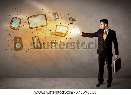 Man throwing hand drawn electronical devices concept