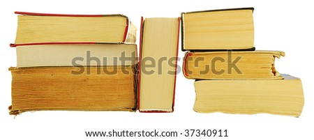 pile of old books on a white background