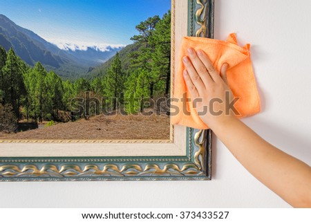 woman hand cleaning a ornate antique.Background pinture are my property
