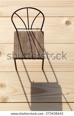 chair and shadow on the wooden floor