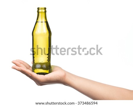 hand holding Glass bottle of aerated soft drink Isolated on white background