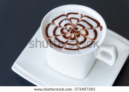 Cup of cappuccino on table