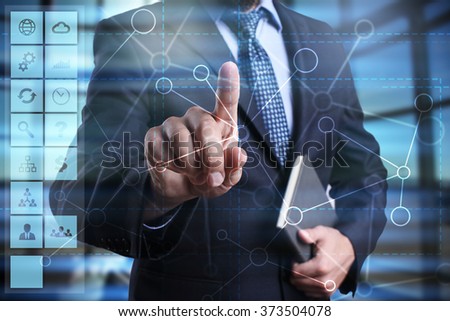 businessman using modern computer, pressing button on virtual screen. business strategy concept. internet, networking and technology concept. 