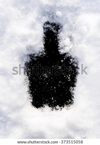 Black background bottle shape in the snow. Perfect window frame for any picture, just replace black color with your image in photo editor, by layered over it in screen mode.