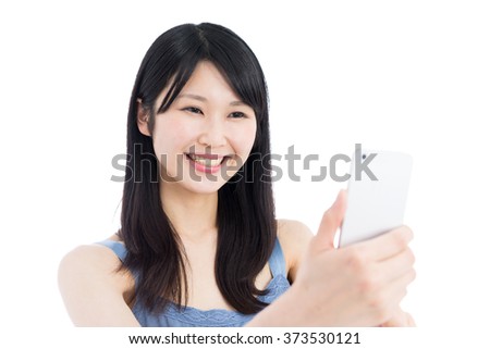 Young Asian woman taking photo with smart phone, isolated on white background