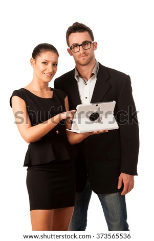 Business couple searching ideas on tablet computer. Team work conceptual image.