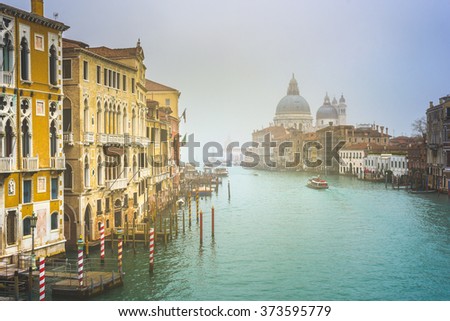 Urban landscape of Venice, water canals with boats.